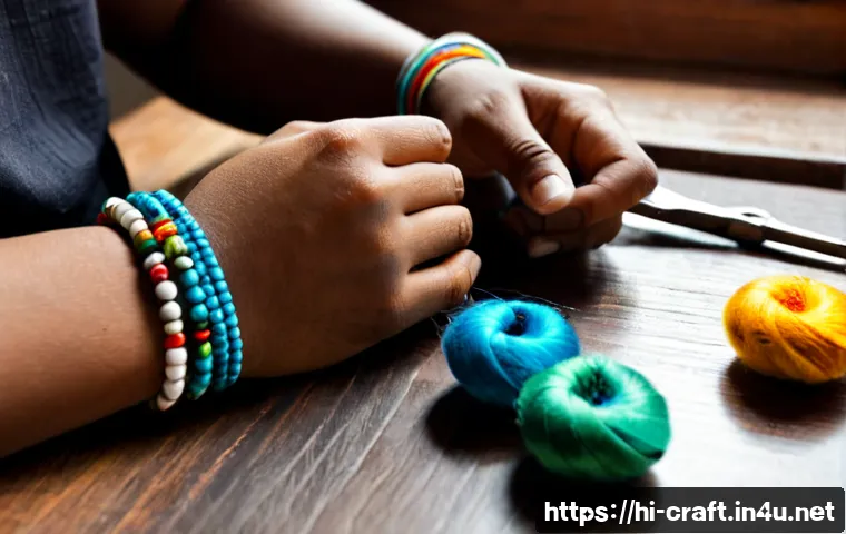 Home 13 수공예 손목걸이 만들기 - Photorealistic close-up of an Indian artisan’s hands making a handcrafted wrist bracelet on a tidy w...